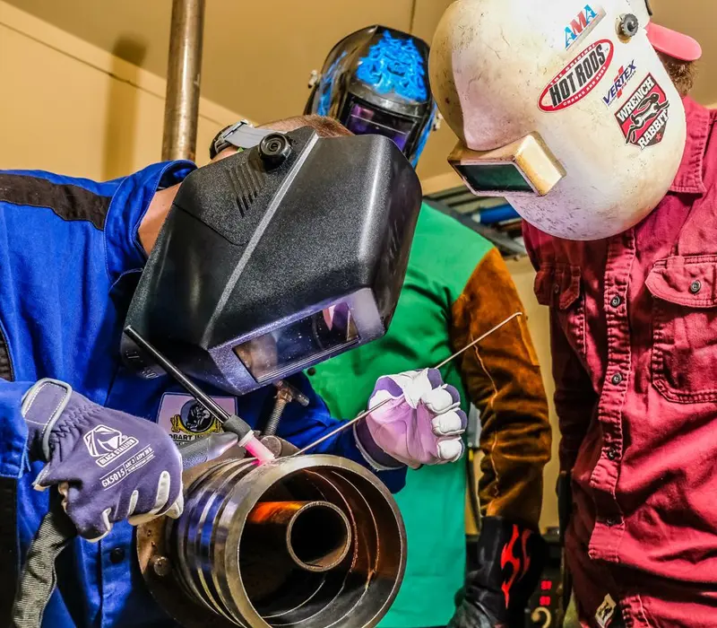 students doing pipe welding